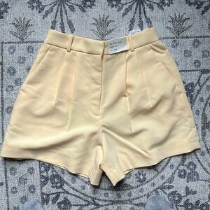 Abercrombie & Fitch Ultra High Pleated shorts.